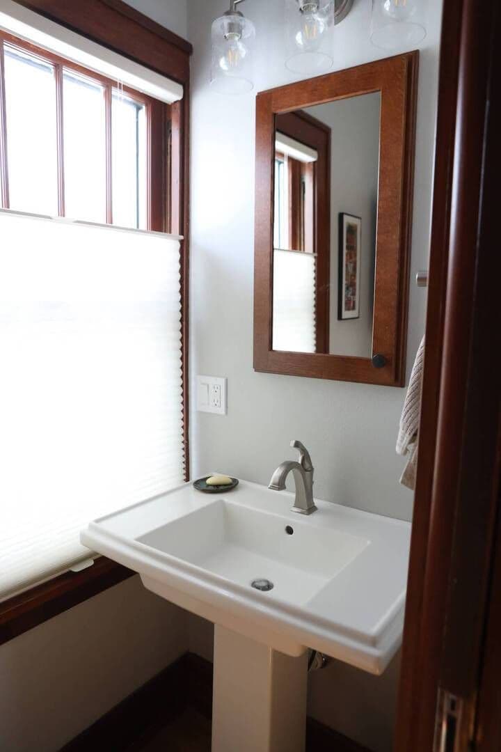 small bathroom with a sink and a mirror