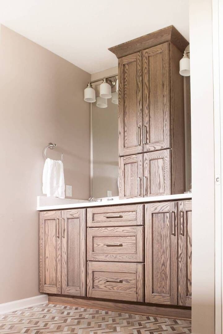 A picture of new cabinets, countertops, and floor tile.