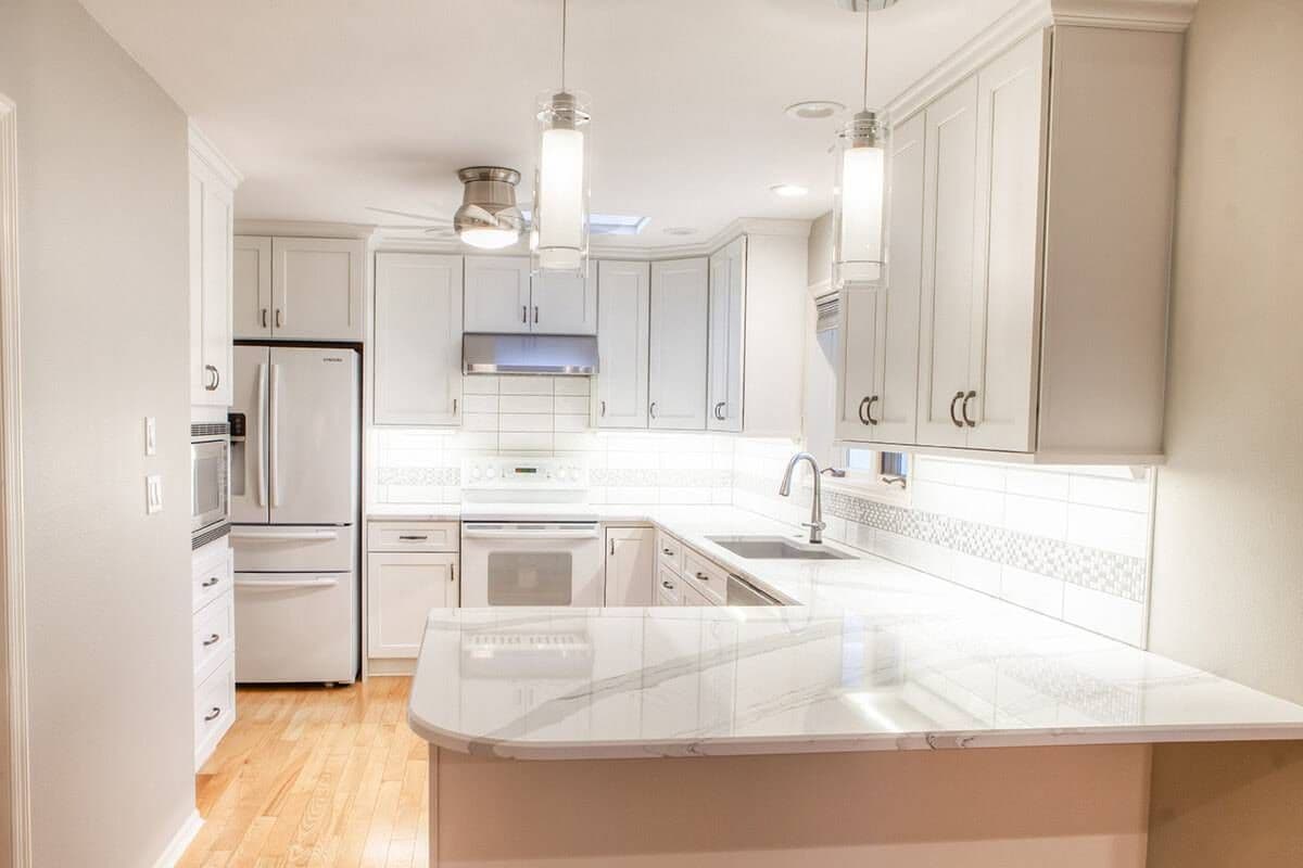 New white counter tops and cabinetry.