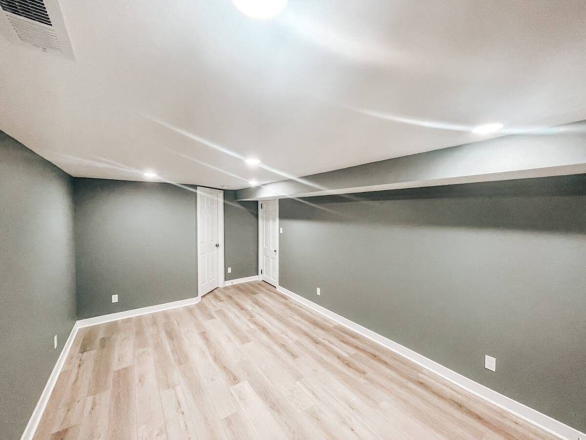 large long basement with recessed lighting